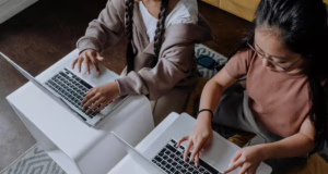 The Definitive Guide for the Ambitious Hustler: Transitioning from Kenya’s Informal Sector to High-Income Remote Digital Skills overhead shot of a children using laptop together